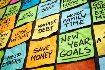 new year goals or resolutions - colorful sticky notes on a blackboard